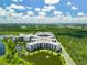 Luxury condos situated on a lakefront with lush landscaping at 14501 Grove Resort Ave # 3132, Winter Garden, FL 34787