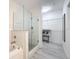 Spa-like bathroom with soaking tub, walk-in shower, and modern vanity at 14501 Grove Resort Ave # 3132, Winter Garden, FL 34787