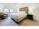 Comfortable bedroom with a queen-size bed and plenty of natural light at 14501 Grove Resort Ave # 3132, Winter Garden, FL 34787