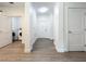 Bright hallway with in-unit laundry and wood floors at 14501 Grove Resort Ave # 3132, Winter Garden, FL 34787