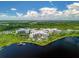 Luxury condo community nestled near a lake with lush greenery at 14501 Grove Resort Ave # 3132, Winter Garden, FL 34787
