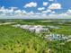 Aerial view of resort community near lake and conservation at 14501 Grove Resort Ave # 3132, Winter Garden, FL 34787