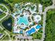 Resort-style pool with waterslides, loungers and landscaping at 14501 Grove Resort Ave # 3132, Winter Garden, FL 34787