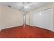 Well-lit bedroom with wood floors and large closet at 15606 Kalihna Ct, Orlando, FL 32828