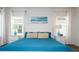 Main bedroom with teal bedding and wood floors at 487 Marcello Blvd, Kissimmee, FL 34746