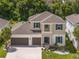 Two-story house with a two-car garage and landscaped yard at 1199 Waterview Ridge Cir, Apopka, FL 32703