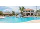 Community pool with large deck and floating ball at 3161 Paradox Cir # 202, Kissimmee, FL 34746