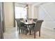 Elegant dining room with a large table and gray chairs at 3161 Paradox Cir # 202, Kissimmee, FL 34746