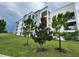 Modern apartment building with landscaped grounds at 3161 Paradox Cir # 202, Kissimmee, FL 34746