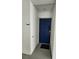 Private apartment entrance with blue door and welcome mat at 3161 Paradox Cir # 202, Kissimmee, FL 34746