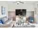 Relaxing living room featuring a large TV and comfortable seating at 3161 Paradox Cir # 202, Kissimmee, FL 34746