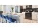 Modern kitchen with stainless steel appliances and an island at 3161 Paradox Cir # 202, Kissimmee, FL 34746