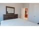 Bedroom with dresser, ensuite access and a double bed at 5553 Veneta Way, Saint Cloud, FL 34771