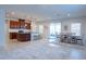 Kitchen with an island, stainless steel appliances, and a dining area at 5553 Veneta Way, Saint Cloud, FL 34771