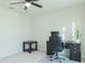 Home office features a large desk, comfortable chair, and side table at 5553 Veneta Way, Saint Cloud, FL 34771