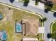 An aerial view of a home with a private pool and screened enclosure at 7001 Oakwood St, Davenport, FL 33837