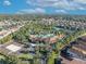 An aerial view of the community clubhouse, pool, and surrounding homes at 7009 Oakwood St, Davenport, FL 33837