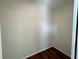 Small storage room with wood-look flooring at 5323 Micco St, Kissimmee, FL 34746