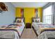 Bedroom with two twin beds and Hogwarts house banners at 5424 Solterra Cir # 1, Davenport, FL 33837