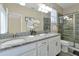 Double vanity bathroom with granite countertop and walk-in shower at 5424 Solterra Cir # 1, Davenport, FL 33837
