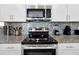 Modern kitchen features stainless steel appliances and granite countertops at 5424 Solterra Cir # 1, Davenport, FL 33837
