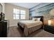Bedroom with ocean-themed wall and a comfortable bed at 5424 Solterra Cir # 1, Davenport, FL 33837