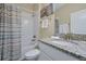 Clean bathroom with shower/tub combo and granite countertop at 5424 Solterra Cir # 1, Davenport, FL 33837