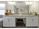 Double vanity bathroom with granite countertops and large mirror at 5424 Solterra Cir # 1, Davenport, FL 33837