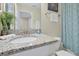 Well-appointed bathroom with granite vanity and shower/tub at 5424 Solterra Cir # 1, Davenport, FL 33837