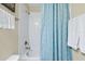 Clean bathroom with shower/tub and light blue shower curtain at 5424 Solterra Cir # 1, Davenport, FL 33837