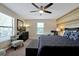 King bedroom with two armchairs, dresser, and ceiling fan at 5424 Solterra Cir # 1, Davenport, FL 33837