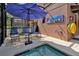 Inviting pool area with lounge chairs, umbrella, and a small pool at 5424 Solterra Cir # 1, Davenport, FL 33837