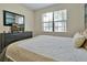 Bright bedroom with a comfortable queen-size bed and dresser at 5424 Solterra Cir # 1, Davenport, FL 33837