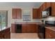 Well-equipped kitchen featuring ample cabinetry and granite counters at 8286 Bridgeport Bay Cir, Mount Dora, FL 32757