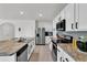 Modern kitchen with stainless steel appliances and granite countertops at 117 Eagleview Loop, Davenport, FL 33837