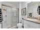 Clean bathroom with a walk-in shower, granite vanity, and modern fixtures at 117 Eagleview Loop, Davenport, FL 33837