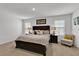 King-size bed and spacious main bedroom with window at 117 Eagleview Loop, Davenport, FL 33837