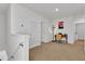 Bright loft area with a desk and built-in shelving at 117 Eagleview Loop, Davenport, FL 33837
