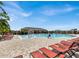 Community pool with lounge chairs and a splash pad at 117 Eagleview Loop, Davenport, FL 33837