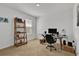 Home office with a desk, shelving, and window at 117 Eagleview Loop, Davenport, FL 33837