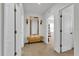 Spacious hallway with a bench, mirror, and light fixtures at 117 Eagleview Loop, Davenport, FL 33837