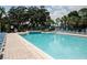 Inviting community pool with lounge chairs at 3478 Westchester Square Blvd # 202, Orlando, FL 32835