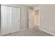 Simple bedroom with double door closet and connecting door at 8217 De Haven Street, Orlando, FL 32832