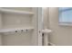 Convenient powder room with pedestal sink and built-in shelving at 8217 De Haven Street, Orlando, FL 32832