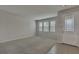 Spacious living room with neutral walls and carpet at 8217 De Haven Street, Orlando, FL 32832