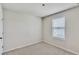Small bedroom with window and single door at 8217 De Haven Street, Orlando, FL 32832