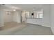 Open concept living space with view of kitchen and stairs at 8217 De Haven Street, Orlando, FL 32832