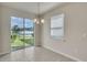 Bright dining area with sliding glass door leading to backyard at 8217 De Haven Street, Orlando, FL 32832