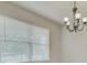 Dining area with a chandelier and window blinds at 8217 De Haven Street, Orlando, FL 32832