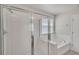 Bathroom with a large shower and soaking tub at 8217 De Haven Street, Orlando, FL 32832